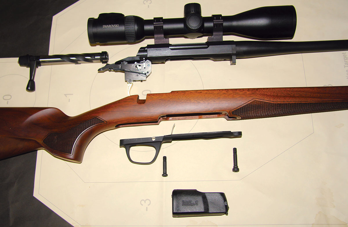 Shown here is a basic blow-up of the Browning X-Bolt 2 Hunter, including from top to bottom, barreled action and bolt, walnut stock, alloy bottom metal, action bolts and detachable magazine.